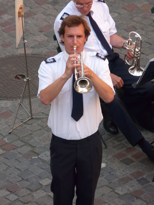 A solo trumpet plays with the band