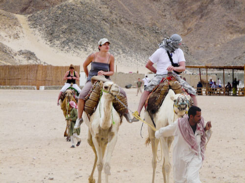 Aude riding a camel